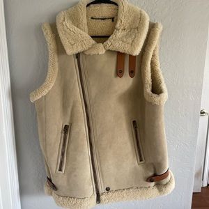 COACH designer shearling/leather vest. Condition—like new.
